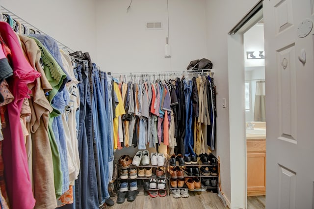 7024 Tree Line Ave NW, Albuquerque, NM 87114 - walk in closet with wood finished floors