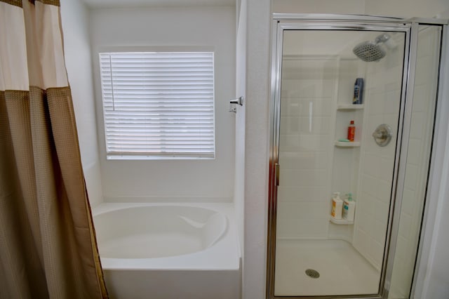 7024 Tree Line Ave NW, Albuquerque, NM 87114 - bathroom featuring a stall shower and a bath