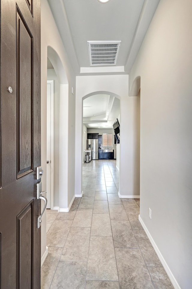 4236 Crowned Eagle Loop NE, Rio Rancho, NM 87144 - entrance foyer with arched walkways, light tile patterned floors, and a tray ceiling