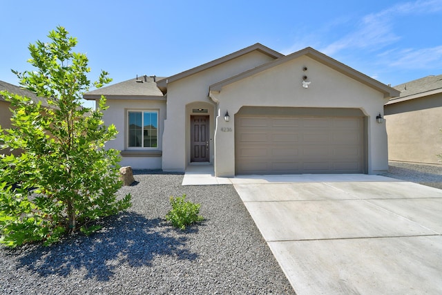 4236 Crowned Eagle Loop NE, Rio Rancho, NM 87144 - ranch-style house featuring an attached garage, stucco siding, and driveway