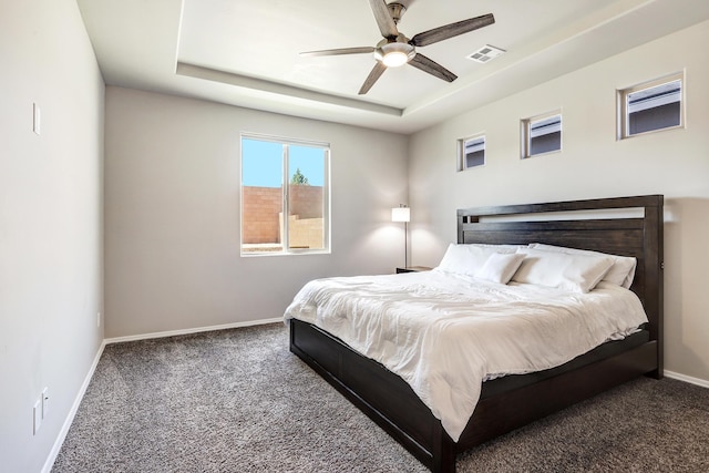 4236 Crowned Eagle Loop NE, Rio Rancho, NM 87144 - carpeted bedroom with a tray ceiling and ceiling fan