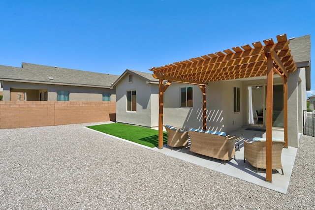 4236 Crowned Eagle Loop NE, Rio Rancho, NM 87144 - back of property with a pergola, an outdoor hangout area, stucco siding, and a patio