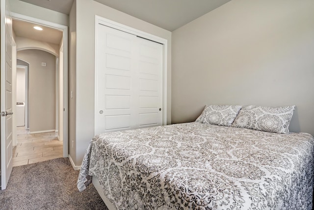 4236 Crowned Eagle Loop NE, Rio Rancho, NM 87144 - bedroom featuring arched walkways, a closet, carpet, and recessed lighting
