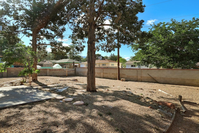 9418 Cordova Ave NE, Albuquerque, NM 87112 - fenced backyard with a patio