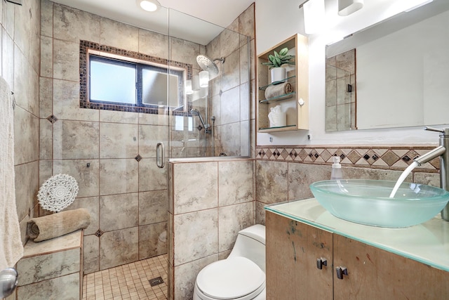 9418 Cordova Ave NE, Albuquerque, NM 87112 - full bathroom featuring tile walls, a shower stall, vanity, and wainscoting