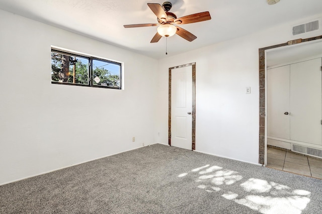 9418 Cordova Ave NE, Albuquerque, NM 87112 - unfurnished bedroom featuring carpet floors and a ceiling fan