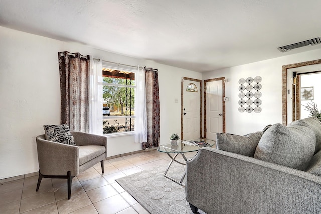 9418 Cordova Ave NE, Albuquerque, NM 87112 - living area with light tile patterned floors and baseboards