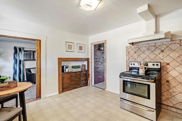 9418 Cordova Ave NE, Albuquerque, NM 87112 - kitchen featuring stainless steel range with electric stovetop and wall chimney range hood