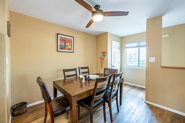 2900 Vista Del Rey NE Unit 18D, Albuquerque, NM 87112 - dining room with wood finished floors, ceiling fan, and a textured wall