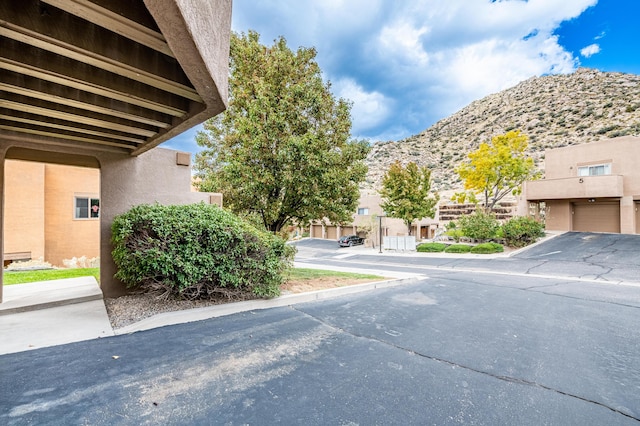2900 Vista Del Rey NE Unit 18D, Albuquerque, NM 87112 - view of asphalt road featuring a mountain view