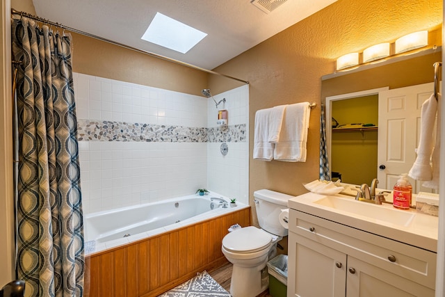 2900 Vista Del Rey NE Unit 18D, Albuquerque, NM 87112 - full bath featuring a skylight, a textured wall, shower / bath combo with shower curtain, and vanity