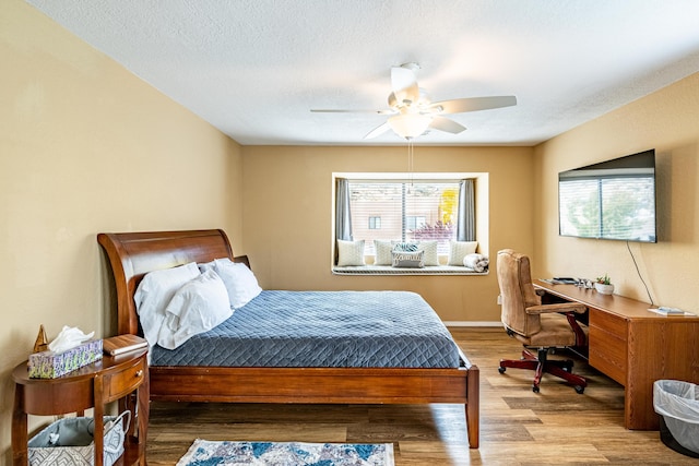 2900 Vista Del Rey NE Unit 18D, Albuquerque, NM 87112 - bedroom featuring wood finished floors and ceiling fan