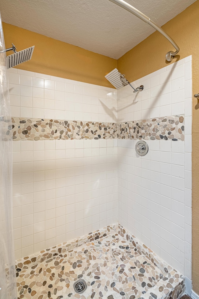 2900 Vista Del Rey NE Unit 18D, Albuquerque, NM 87112 - full bathroom featuring tiled shower and a textured ceiling
