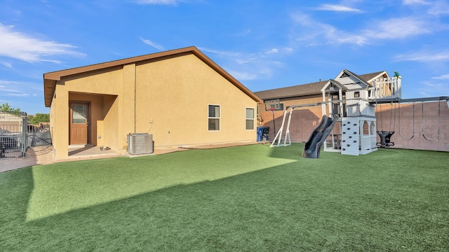 2404 Del Timbre Ln SW, Albuquerque, NM 87121 - rear view of property featuring a playground, a fenced backyard, and stucco siding