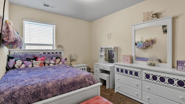 2404 Del Timbre Ln SW, Albuquerque, NM 87121 - bedroom with dark colored carpet and a textured ceiling
