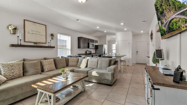 2404 Del Timbre Ln SW, Albuquerque, NM 87121 - living area with light tile patterned floors, a textured ceiling, recessed lighting, and vaulted ceiling