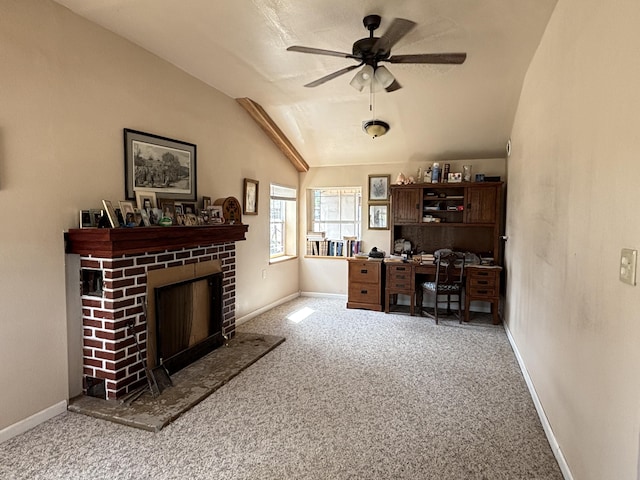 2 Bus Ln, Sandia Park, NM 87047 - carpeted office featuring vaulted ceiling, ceiling fan, and a fireplace