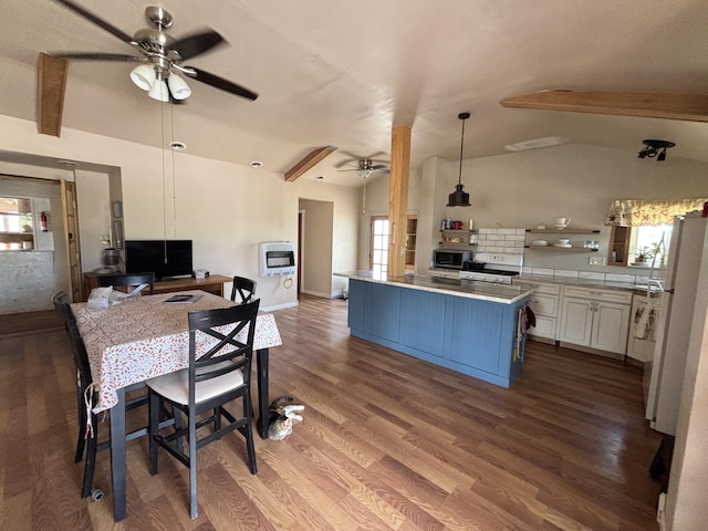 2 Bus Ln, Sandia Park, NM 87047 - kitchen featuring a ceiling fan, white appliances, heating unit, and healthy amount of natural light