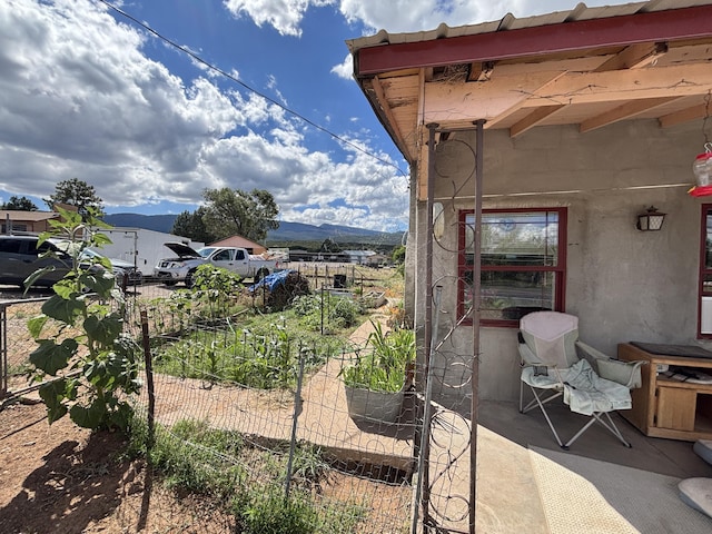 2 Bus Ln, Sandia Park, NM 87047 - view of patio with a mountain view