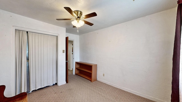 604 9th St SW, Albuquerque, NM 87102 - unfurnished bedroom with light colored carpet and a ceiling fan