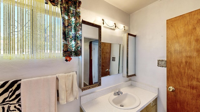 604 9th St SW, Albuquerque, NM 87102 - bathroom featuring vanity and healthy amount of natural light