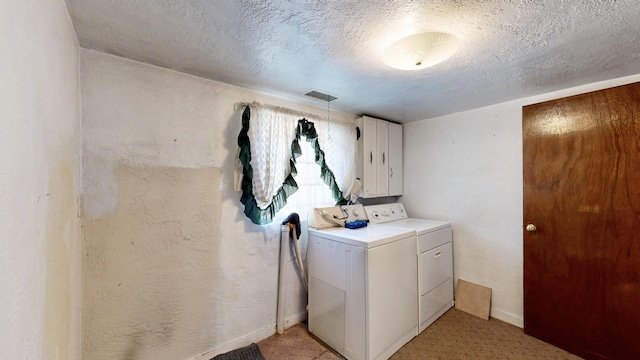 604 9th St SW, Albuquerque, NM 87102 - washroom with washer and dryer, cabinet space, and a textured ceiling