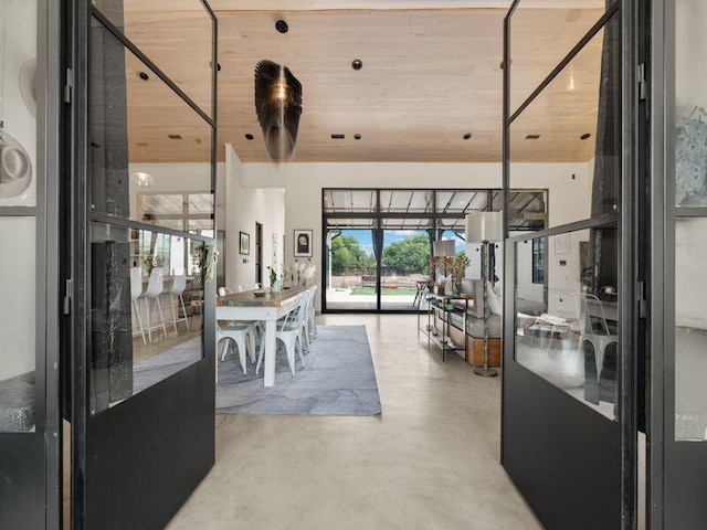400 Perea Ln, Corrales, NM 87048 - dining area featuring concrete flooring and wooden ceiling