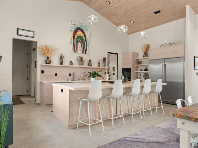 400 Perea Ln, Corrales, NM 87048 - kitchen featuring built in fridge, open shelves, modern cabinets, a breakfast bar, and high vaulted ceiling