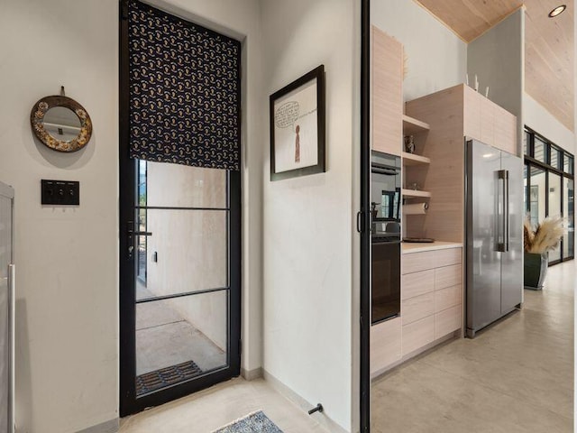 400 Perea Ln, Corrales, NM 87048 - kitchen featuring high end fridge, oven, open shelves, modern cabinets, and vaulted ceiling