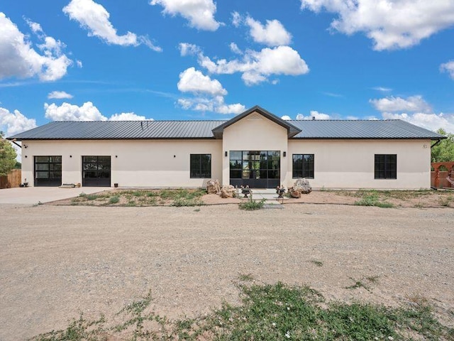 400 Perea Ln, Corrales, NM 87048 - back of property featuring stucco siding and a metal roof