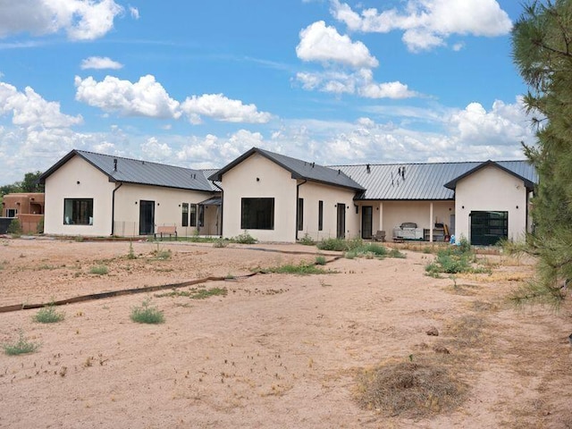 400 Perea Ln, Corrales, NM 87048 - back of property featuring stucco siding and a metal roof