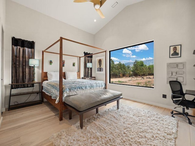400 Perea Ln, Corrales, NM 87048 - bedroom with light wood-style floors, high vaulted ceiling, ceiling fan, and a desk