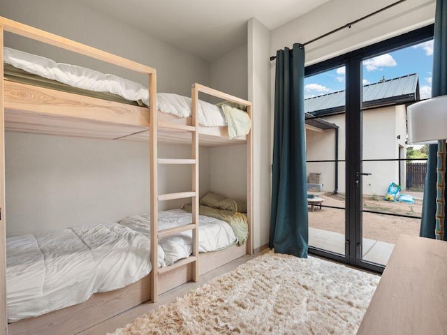 400 Perea Ln, Corrales, NM 87048 - bedroom with multiple windows and access to outside