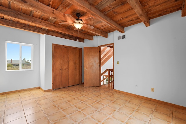 118 Sandia View Rd, Corrales, NM 87048 - unfurnished bedroom with a wood ceiling with exposed beams, a closet, and light tile patterned floors