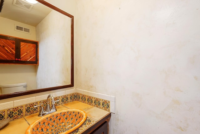 118 Sandia View Rd, Corrales, NM 87048 - bathroom with vanity and backsplash