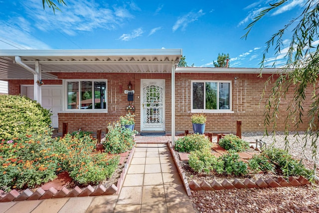 7719 Euclid Ave NE, Albuquerque, NM 87110 - property entrance featuring brick siding and covered porch