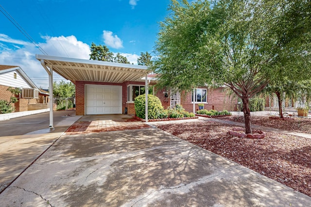 7719 Euclid Ave NE, Albuquerque, NM 87110 - view of front of home with brick siding, a carport, concrete driveway, and an attached garage