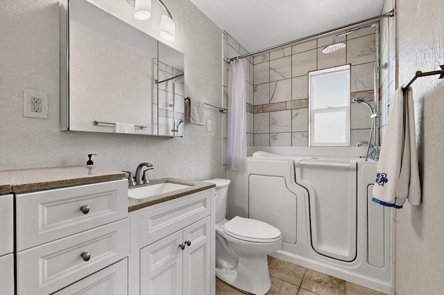7719 Euclid Ave NE, Albuquerque, NM 87110 - full bath with a textured wall, vanity, tile patterned flooring, and shower / bathtub combination with curtain