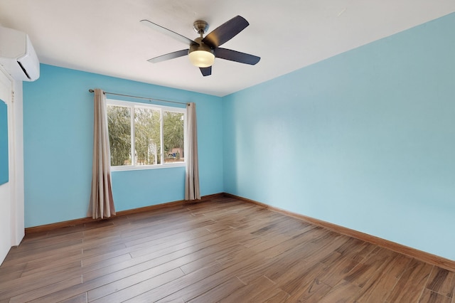7719 Euclid Ave NE, Albuquerque, NM 87110 - spare room featuring ceiling fan, a wall unit AC, and wood finished floors