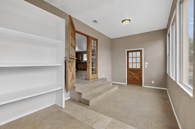 1519 Lundy Ln SW, Albuquerque, NM 87105 - foyer featuring french doors and plenty of natural light