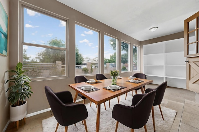 1519 Lundy Ln SW, Albuquerque, NM 87105 - dining room with light tile patterned floors and baseboards