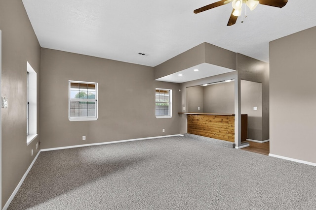 1519 Lundy Ln SW, Albuquerque, NM 87105 - unfurnished living room featuring carpet and a ceiling fan