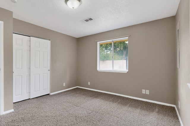 1519 Lundy Ln SW, Albuquerque, NM 87105 - unfurnished bedroom with carpet, a closet, and a textured ceiling