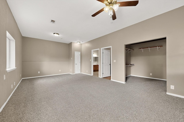 1519 Lundy Ln SW, Albuquerque, NM 87105 - unfurnished bedroom featuring carpet flooring, connected bathroom, a walk in closet, and ceiling fan