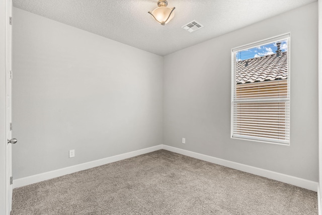 2520 Guadalupe Rd NE, Rio Rancho, NM 87144 - carpeted empty room with baseboards and a textured ceiling