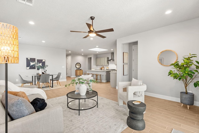 2520 Guadalupe Rd NE, Rio Rancho, NM 87144 - living room with ceiling fan, light wood-style floors, and recessed lighting