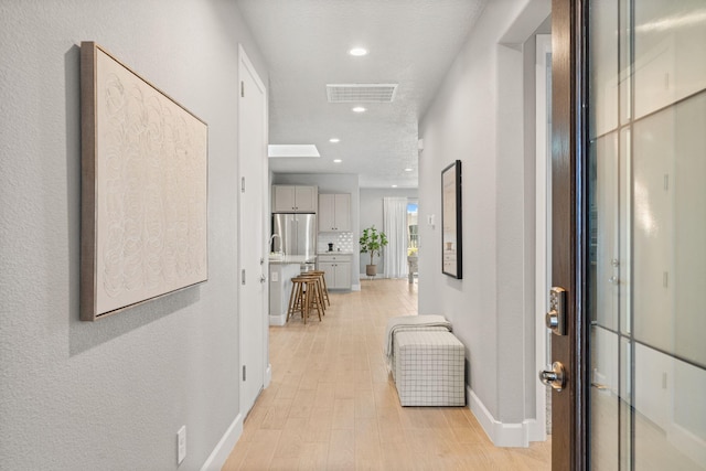 2520 Guadalupe Rd NE, Rio Rancho, NM 87144 - hall featuring light wood-style flooring and recessed lighting