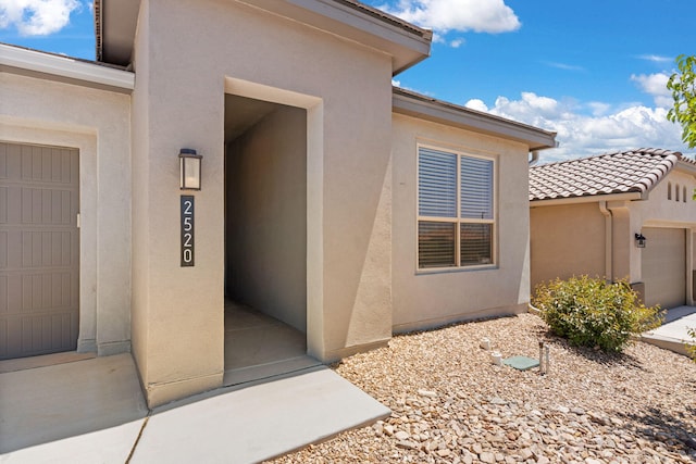 2520 Guadalupe Rd NE, Rio Rancho, NM 87144 - property entrance with stucco siding and a tile roof