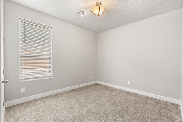 2520 Guadalupe Rd NE, Rio Rancho, NM 87144 - carpeted empty room with baseboards and a textured ceiling