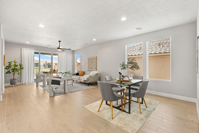 2520 Guadalupe Rd NE, Rio Rancho, NM 87144 - dining room featuring a textured ceiling, light wood-type flooring, recessed lighting, and ceiling fan